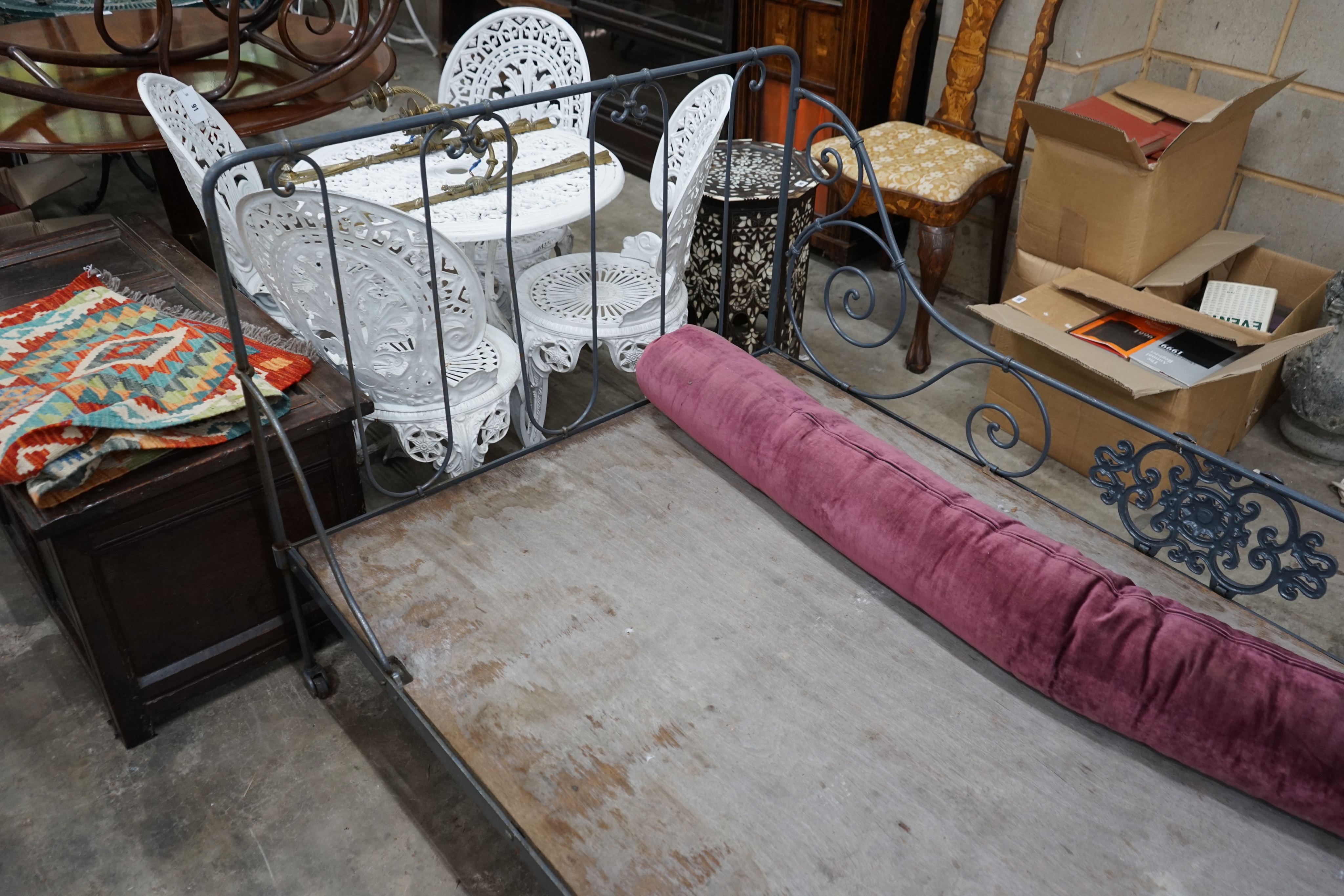 A late Victorian wrought iron bed frame, length 188cm depth 110cm height 96cm